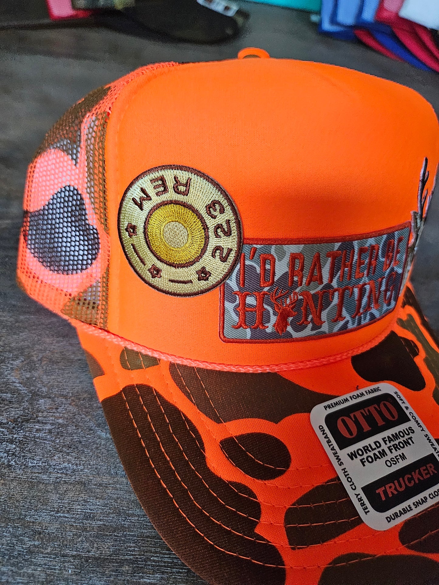 Neon orange camo trucker hat