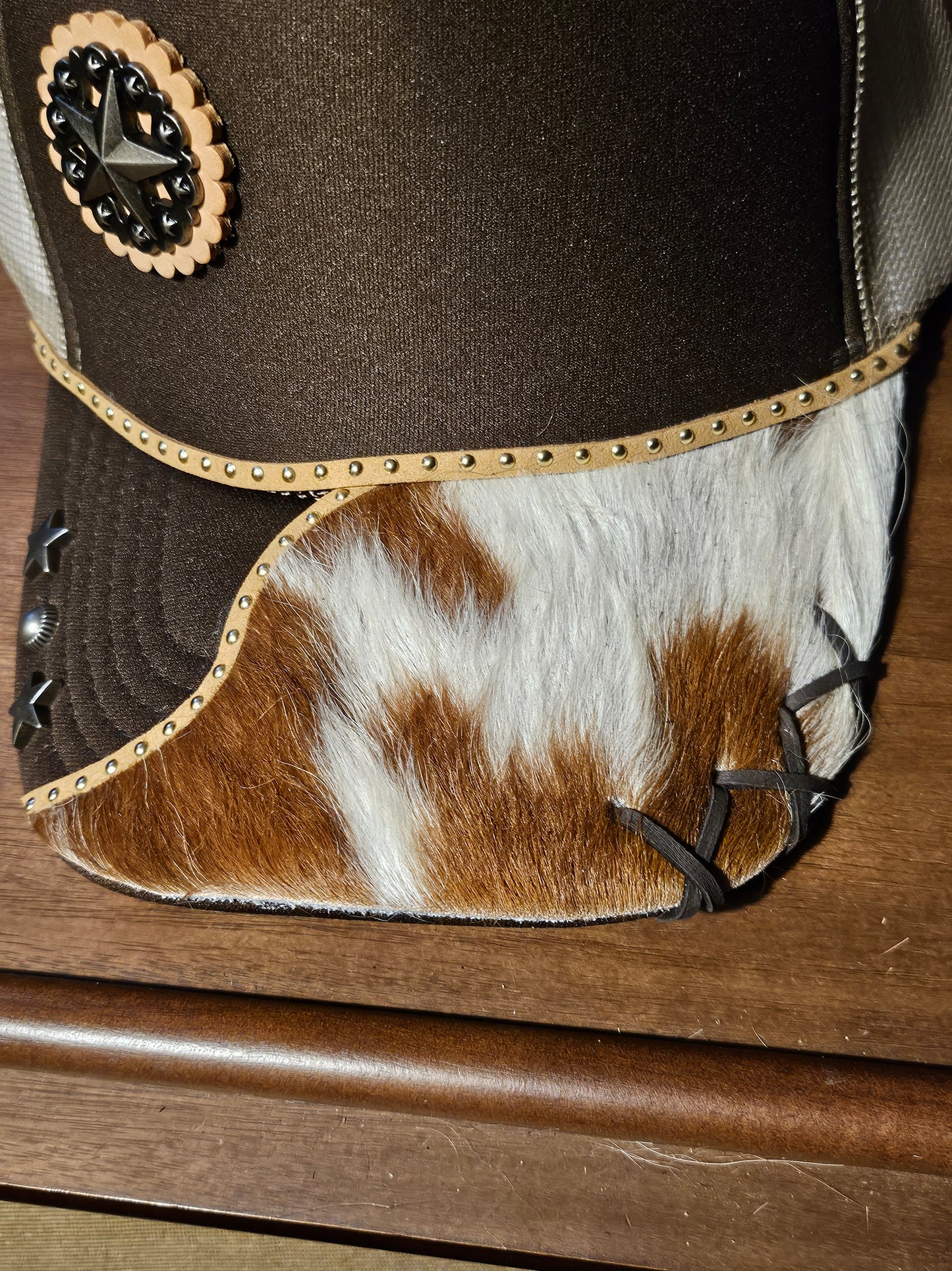 Western trucker hat with cowhide and conchos