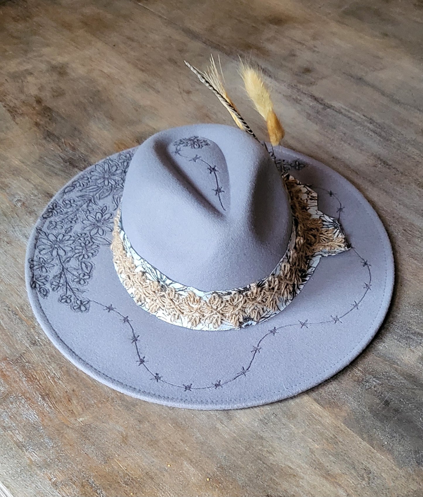 "Stormy" is our new grey burned felt fedora cowgirl hat with feather and wheat. fully adjustable