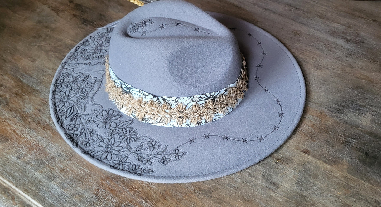 "Stormy" is our new grey burned felt fedora cowgirl hat with feather and wheat. fully adjustable