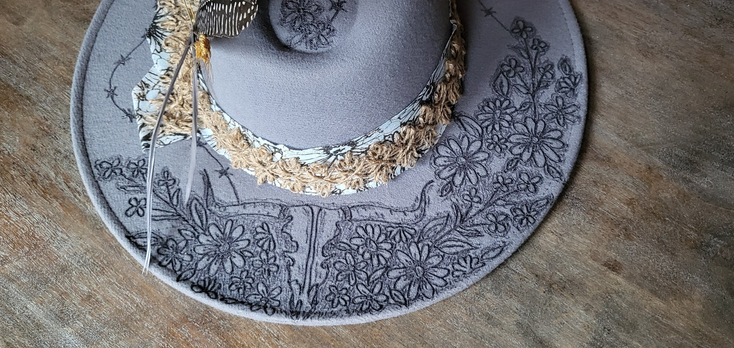 "Stormy" is our new grey burned felt fedora cowgirl hat with feather and wheat. fully adjustable