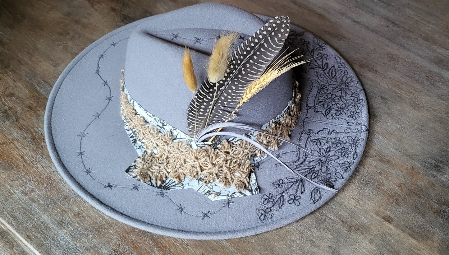 "Stormy" is our new grey burned felt fedora cowgirl hat with feather and wheat. fully adjustable