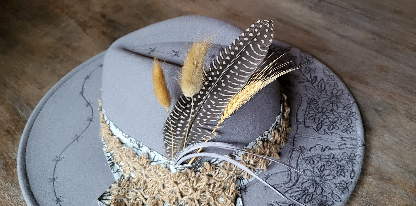 "Stormy" is our new grey burned felt fedora cowgirl hat with feather and wheat. fully adjustable