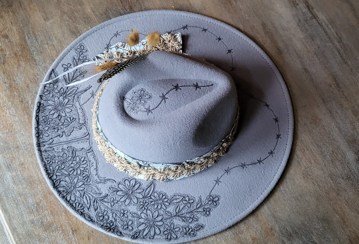 "Stormy" is our new grey burned felt fedora cowgirl hat with feather and wheat. fully adjustable