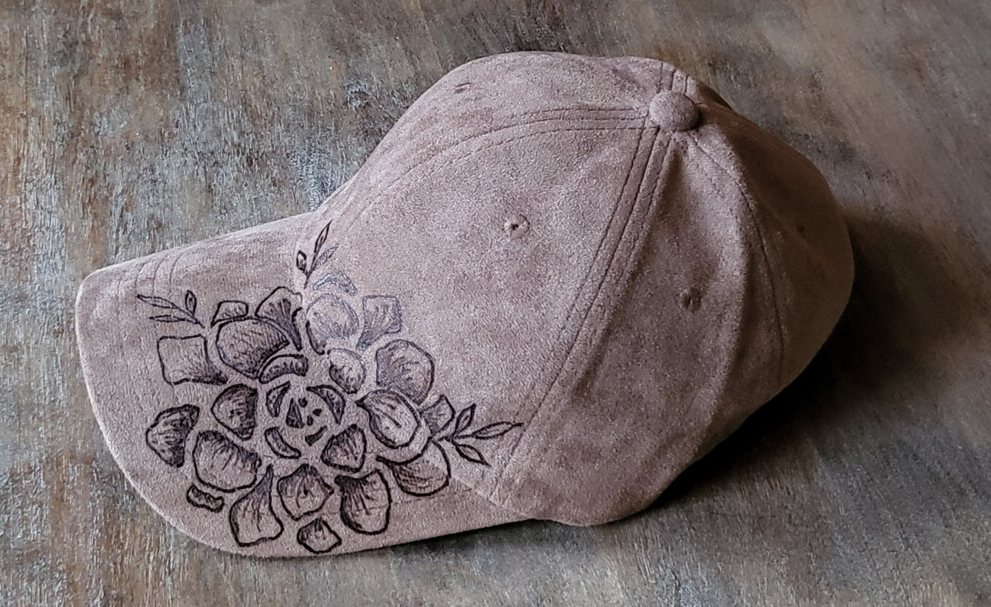 Hand burned suede baseball cap with adjustable back