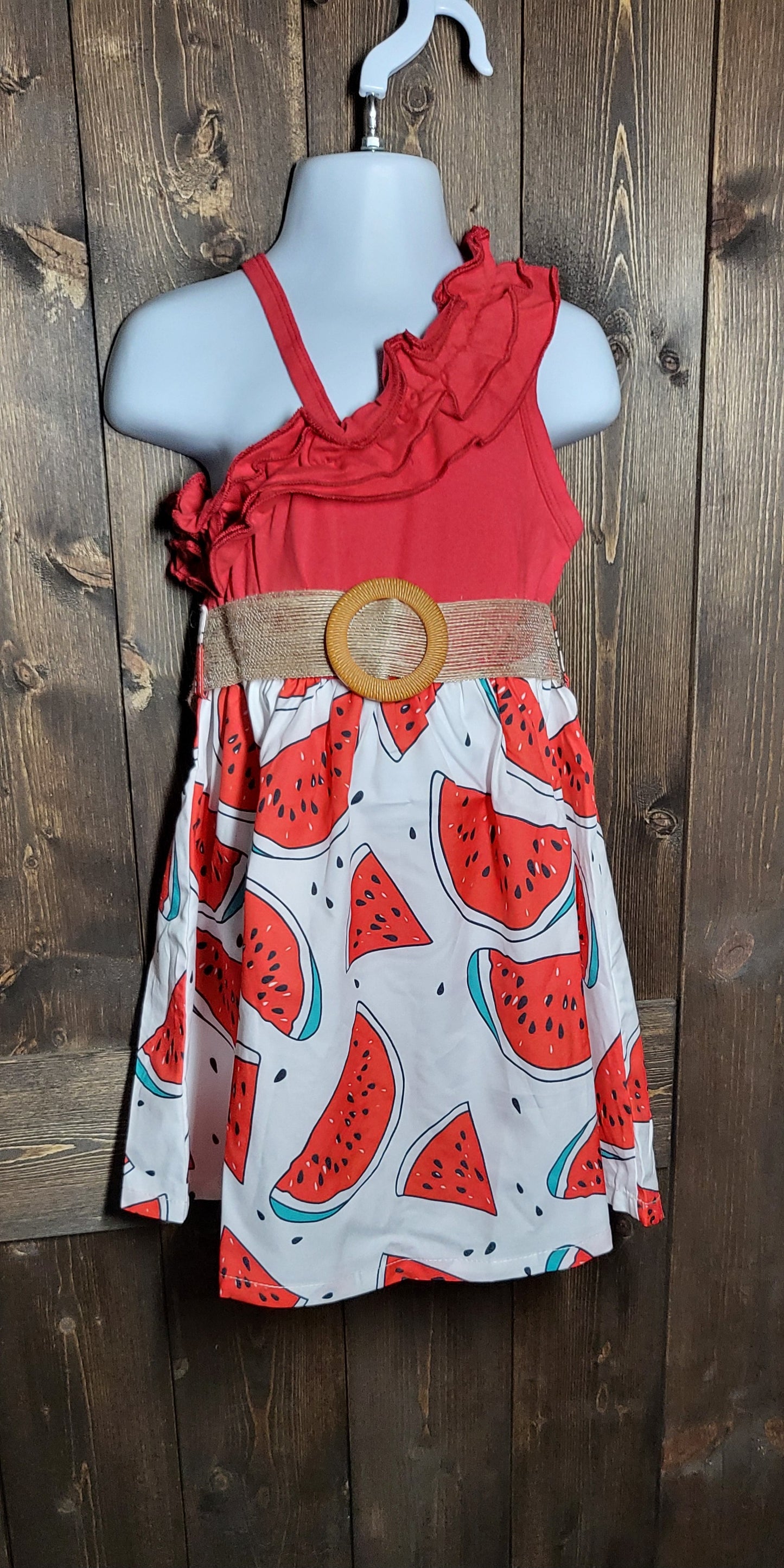 Adorable girls dresses in cowprint, sunflower, and watermelon with a cropped jean jacket