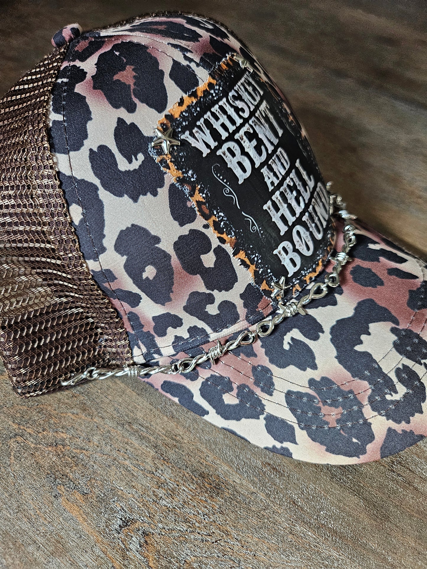 Custom leopard print "whiskey bent and hell bound" trucker pont tail hat with barbed wire hat band