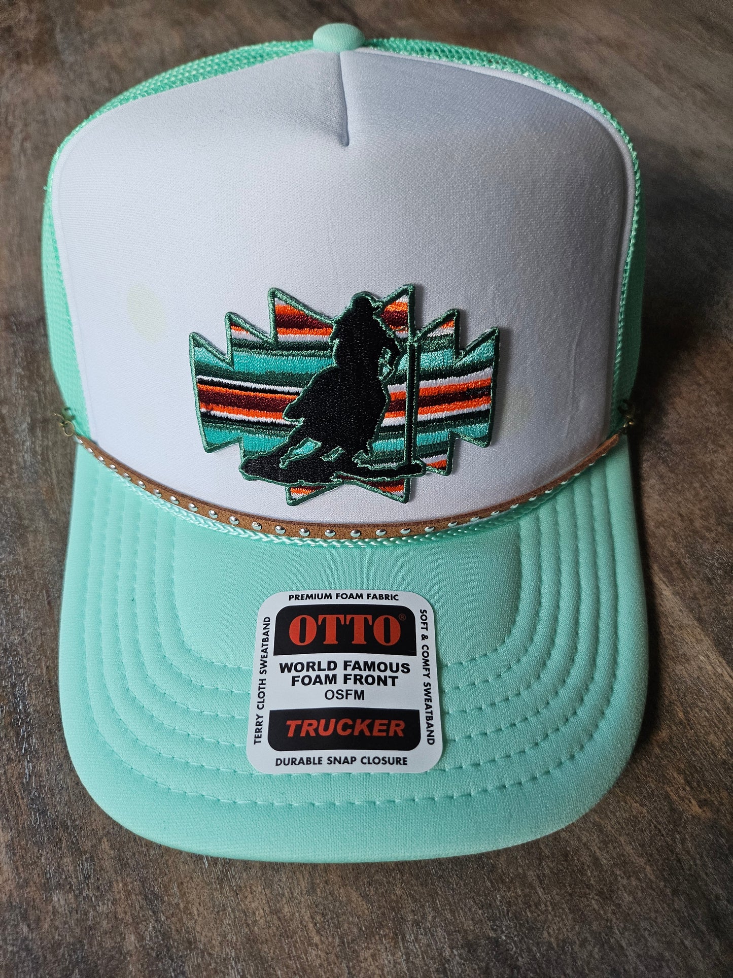 Custom trucker hats with pole bending rodeo patches