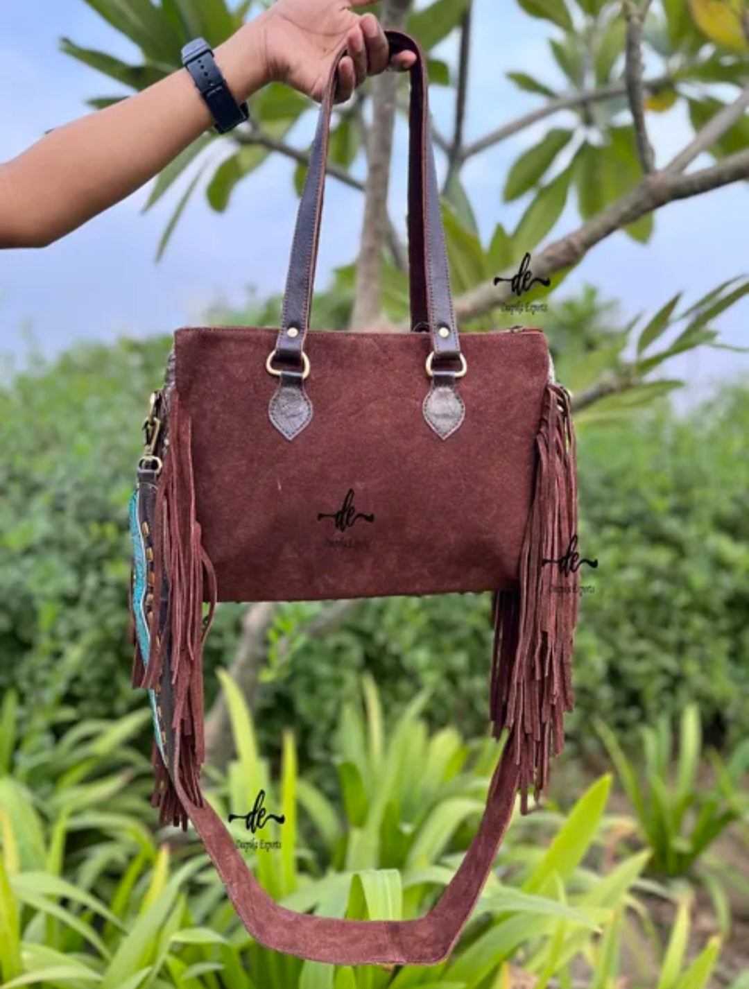 western embossed turquoise, and hair on cowhide leather and suede purse fringe, and both crossbody and handbag straps