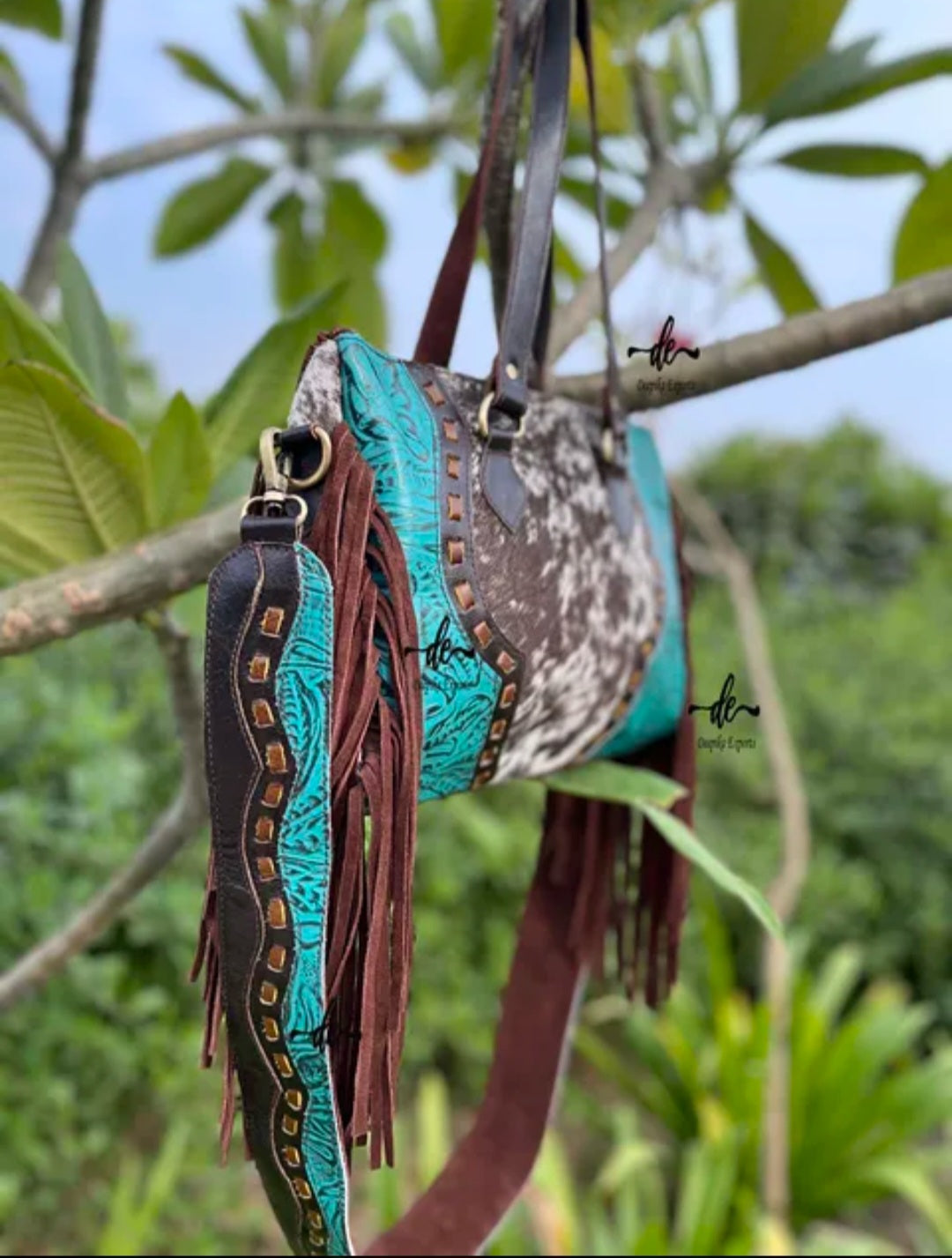 western embossed turquoise, and hair on cowhide leather and suede purse fringe, and both crossbody and handbag straps