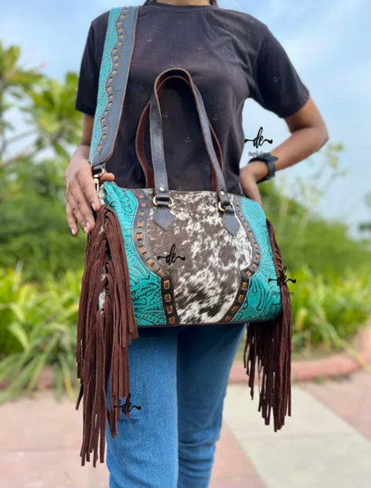 western embossed turquoise, and hair on cowhide leather and suede purse fringe, and both crossbody and handbag straps