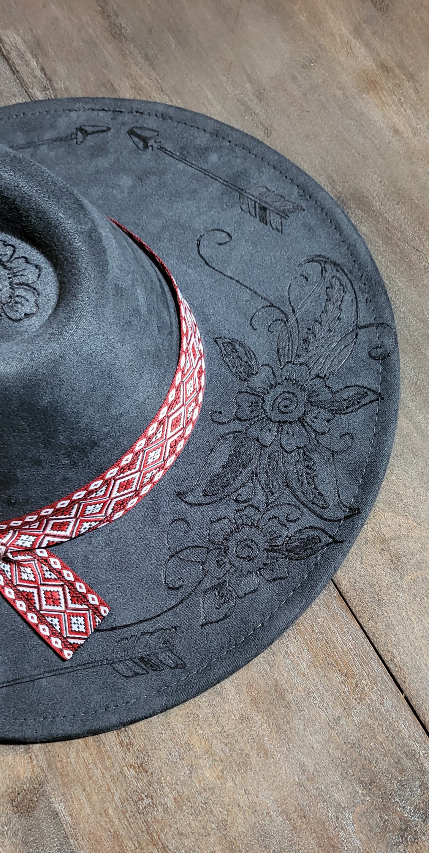 Grey suede burned cowboy hat fedora with the saying "forget the first arrow, only the next one counts"